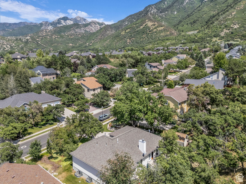 Aerial perspective of suburban area with a mountain backdrop