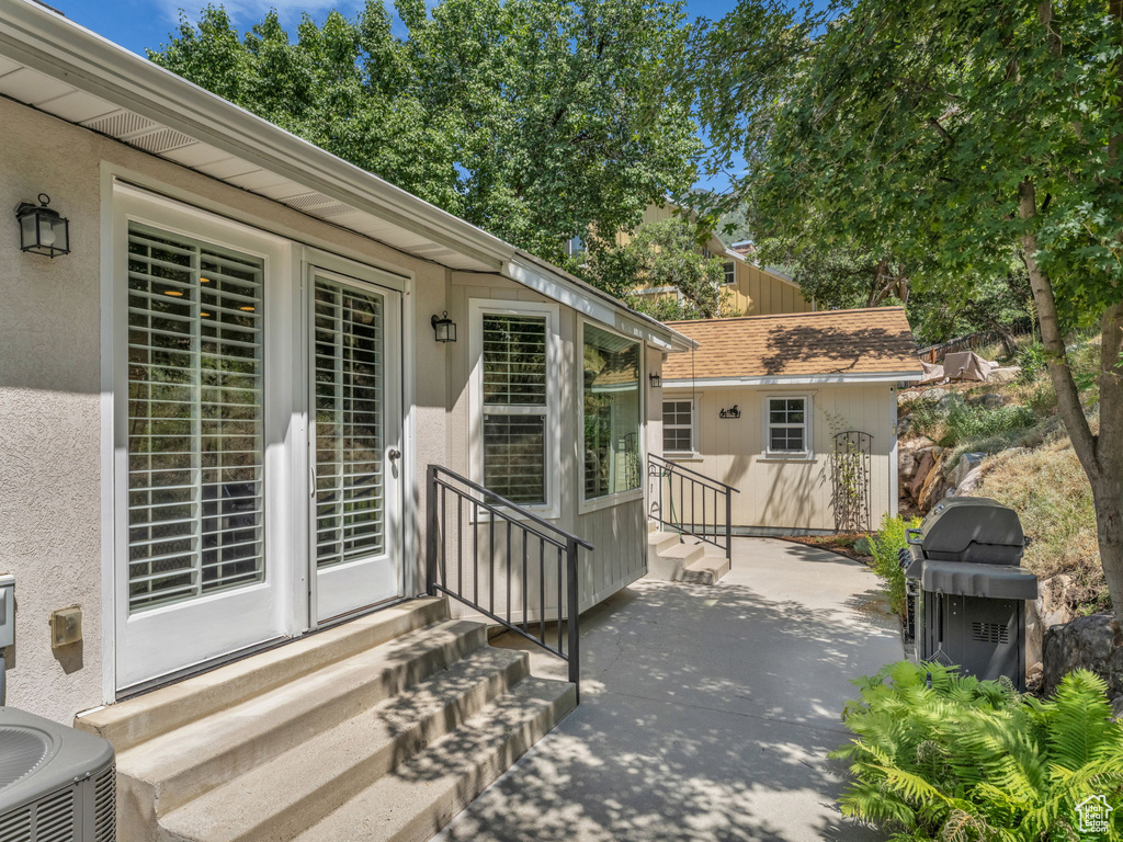 View of patio / terrace featuring entry steps and a grill