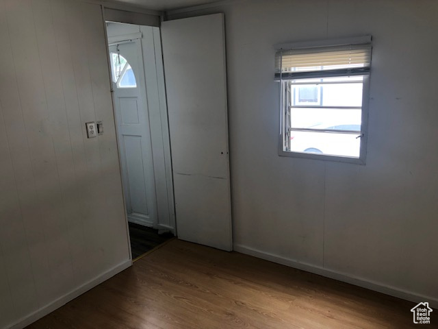 Spare room with wood finished floors and baseboards