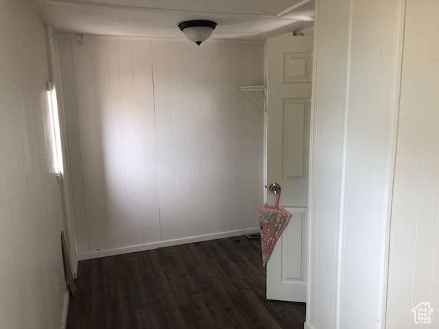 Interior space with dark wood finished floors and baseboards
