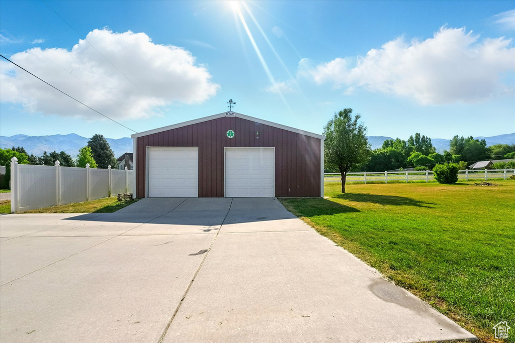 Detached garage featuring a mountain view
