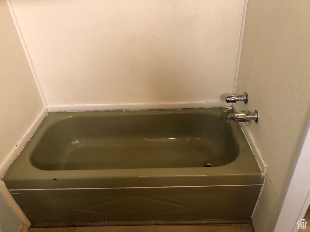 Full bath featuring a bathtub