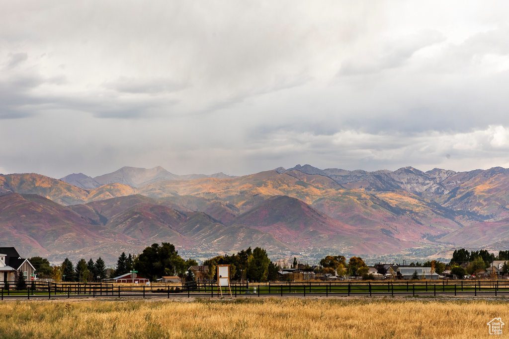 View of mountain backdrop featuring rural landscape