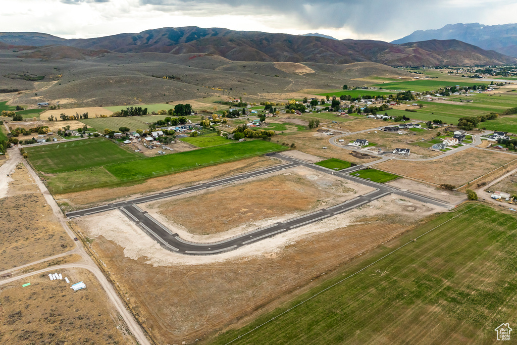 View of property location with a mountain backdrop and rural landscape