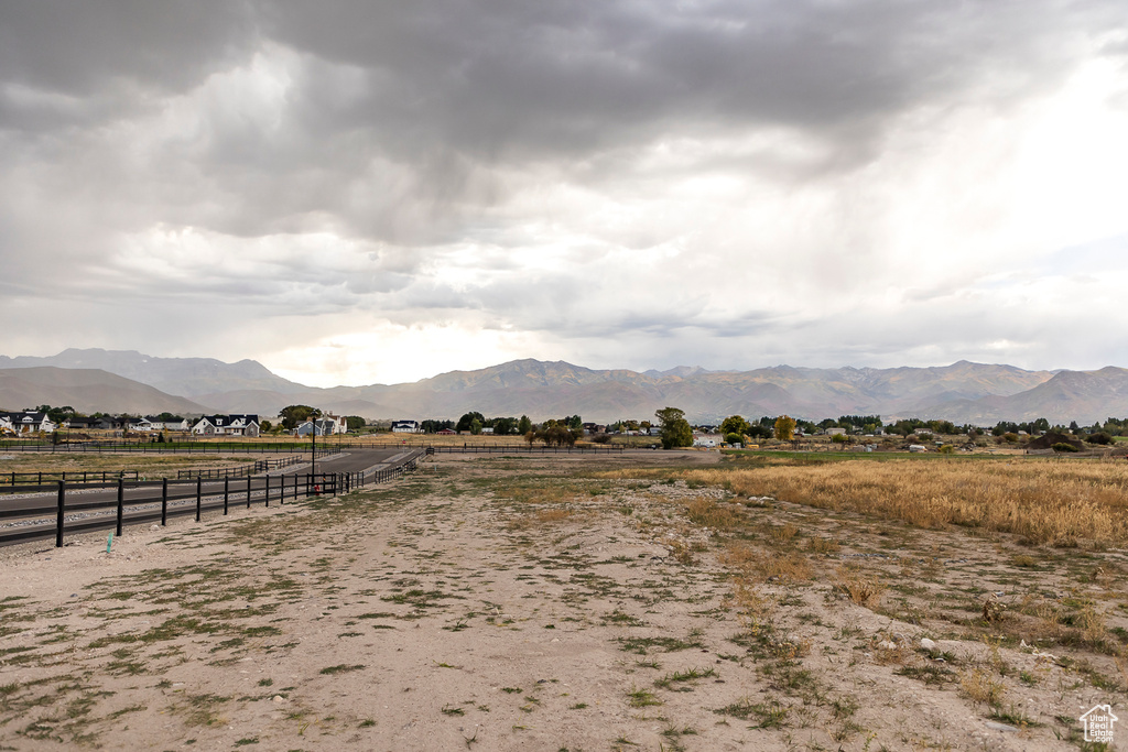 View of mountain backdrop featuring rural landscape