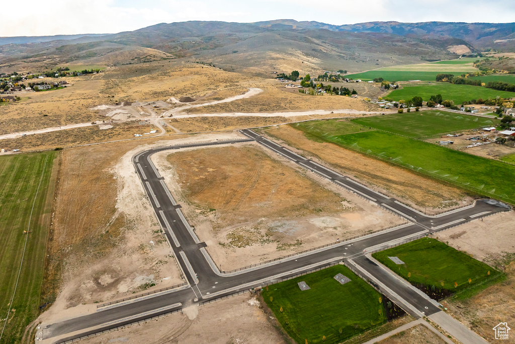 Aerial view of sparsely populated area with a mountainous background