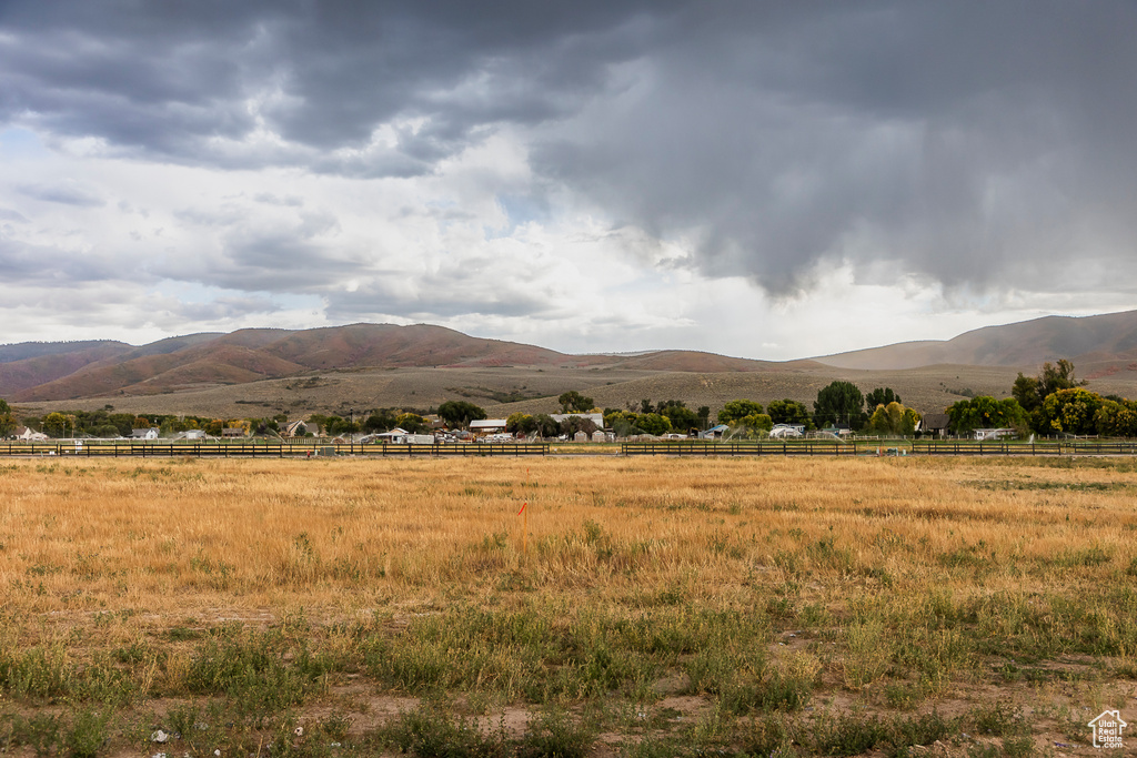 View of mountain backdrop with rural landscape