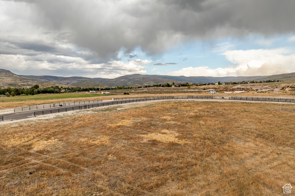 View of mountain backdrop with rural landscape