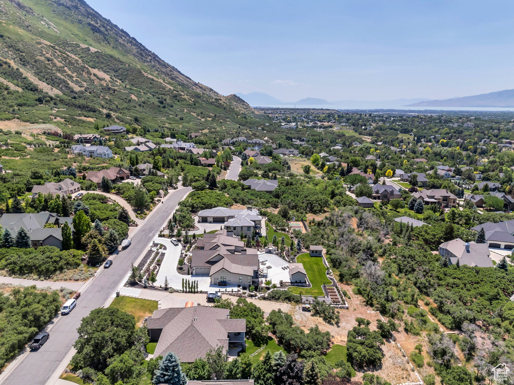 Aerial view of residential area featuring a mountainous background