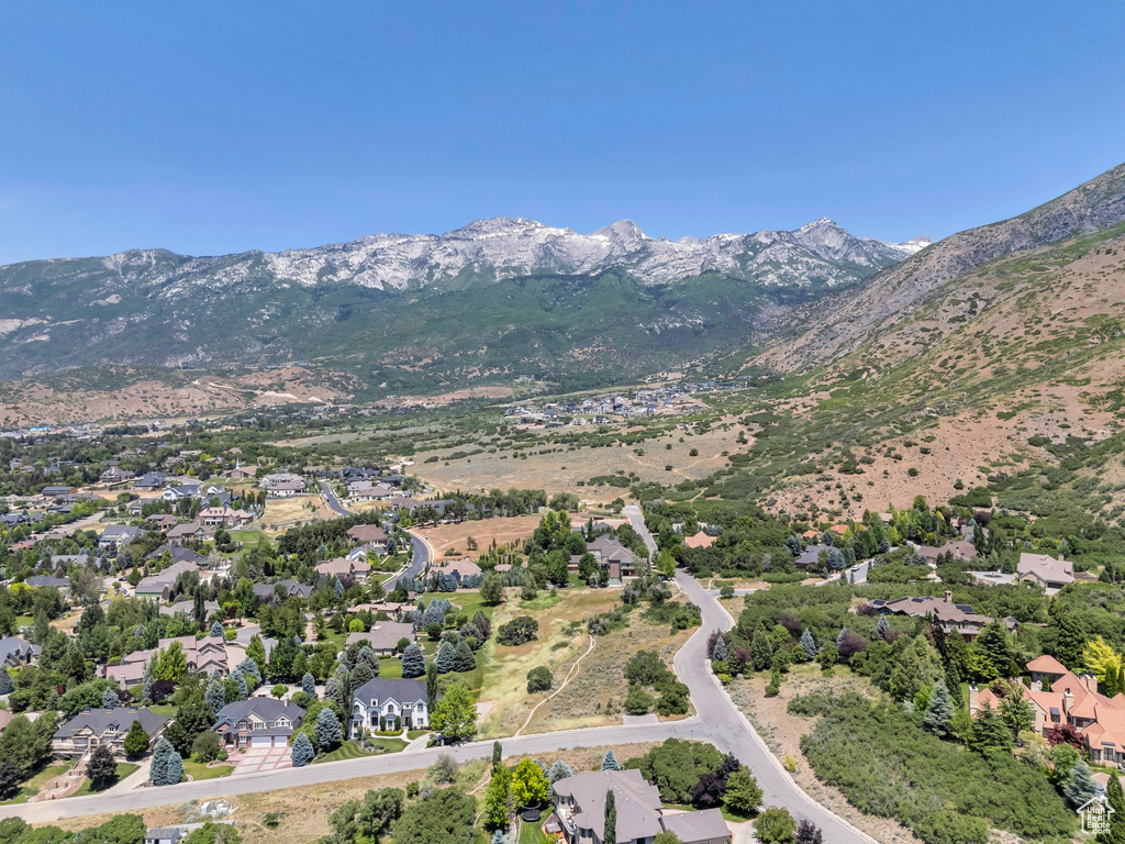 View of property location with a mountain backdrop and nearby suburban area