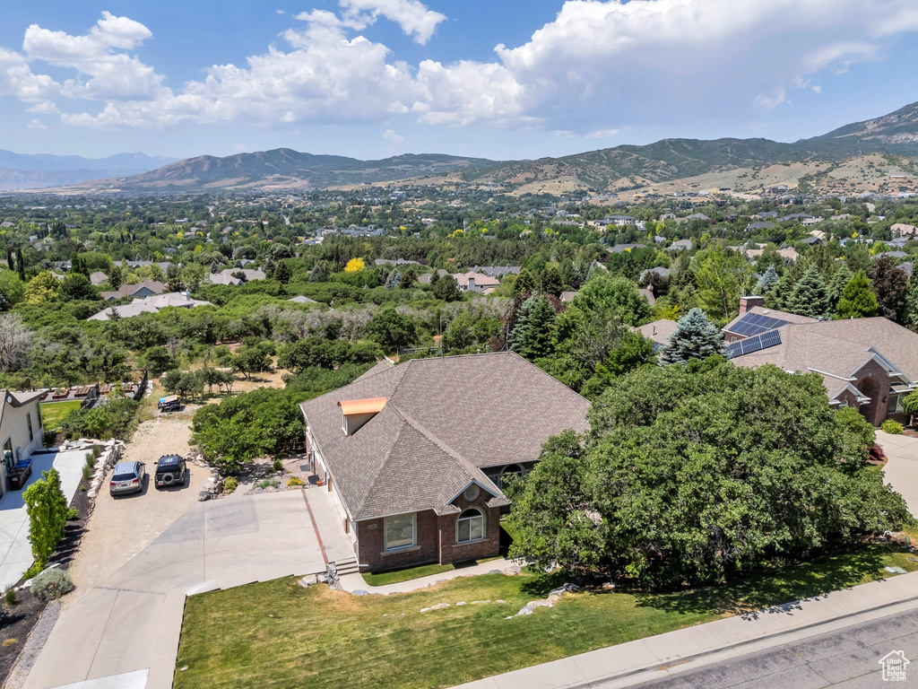 View of subject property with a mountain backdrop