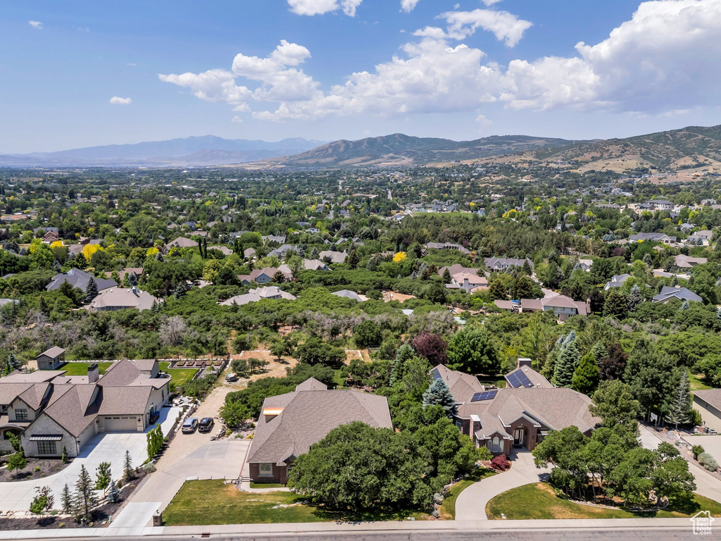 Aerial view of residential area featuring a mountain backdrop