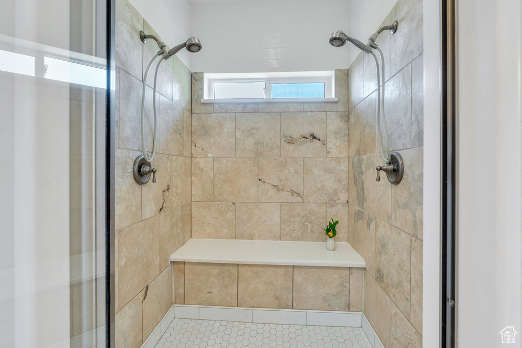 Full bathroom with a shower stall