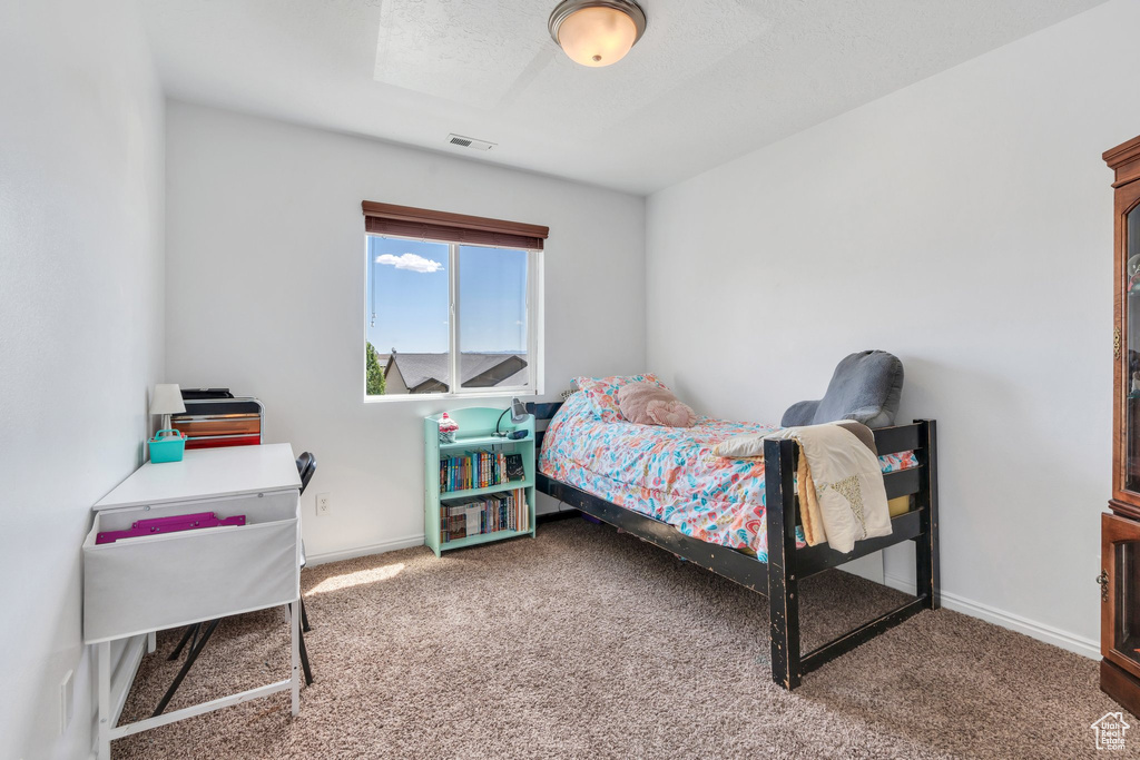 Bedroom with carpet flooring