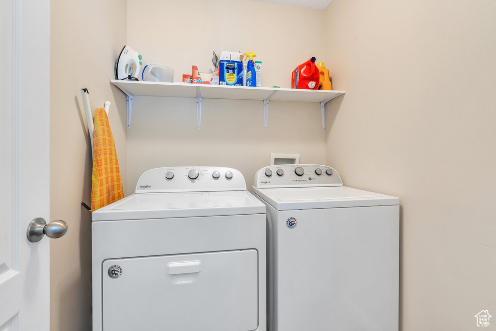 Washroom featuring independent washer and dryer