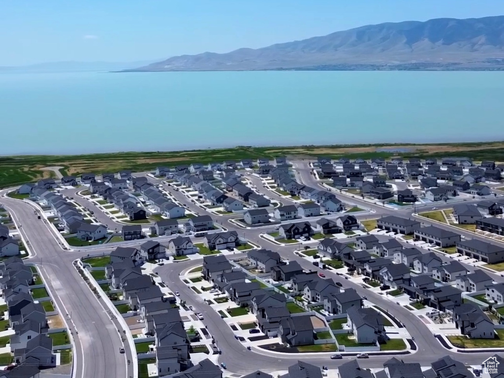 Aerial view of residential area featuring a water and mountain view