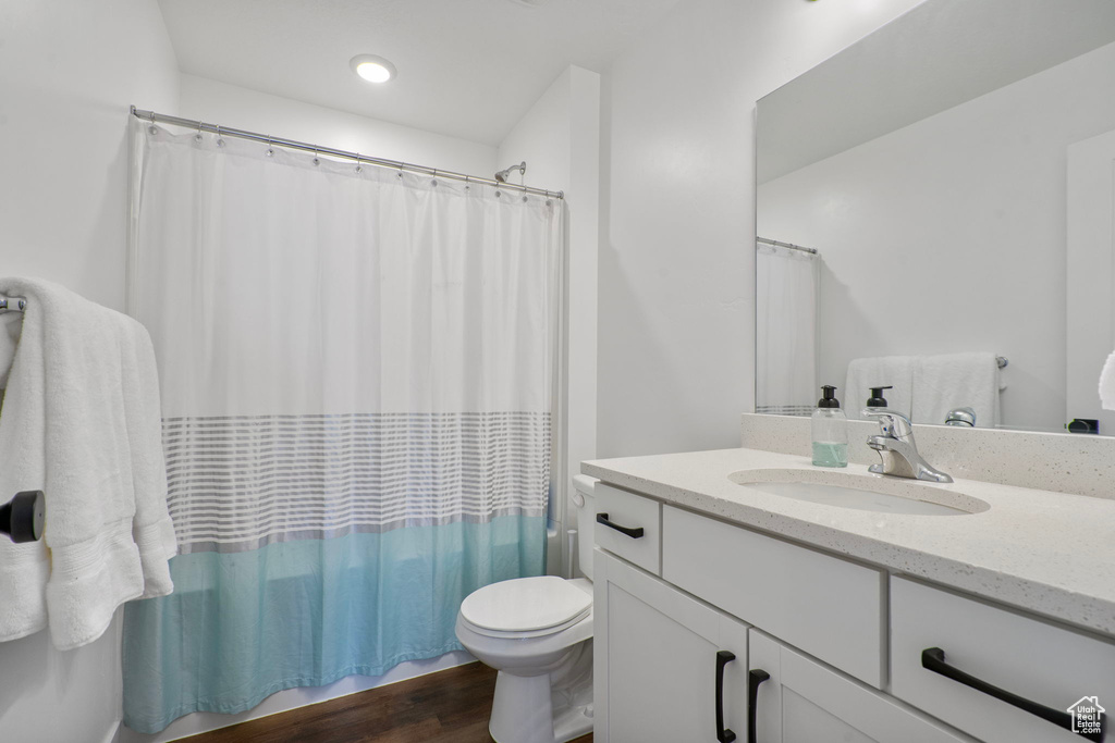 Bathroom with vanity and wood finished floors
