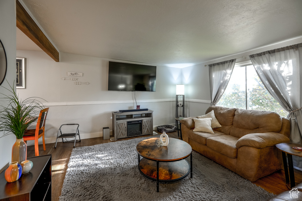 Living room with wood finished floors and baseboards