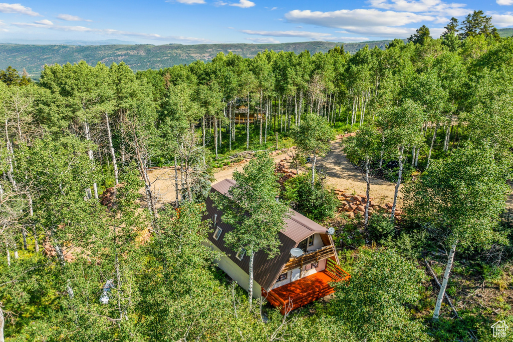View of subject property with a heavily wooded area