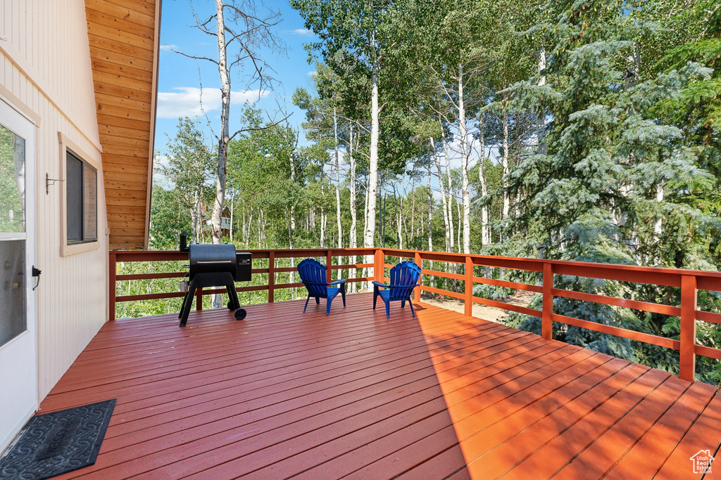 Deck with view of scattered trees