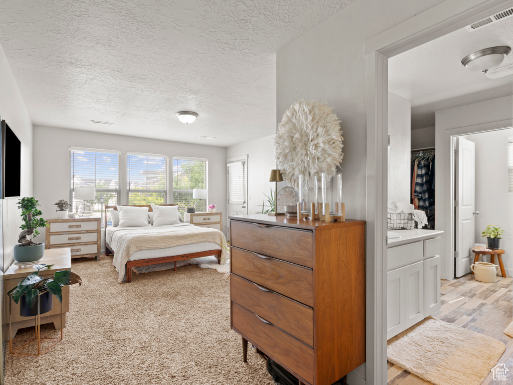 Bedroom with a textured ceiling