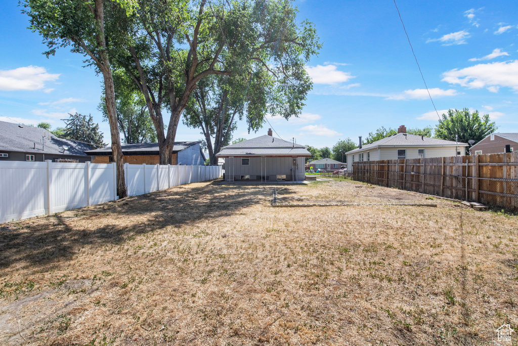 View of fenced backyard