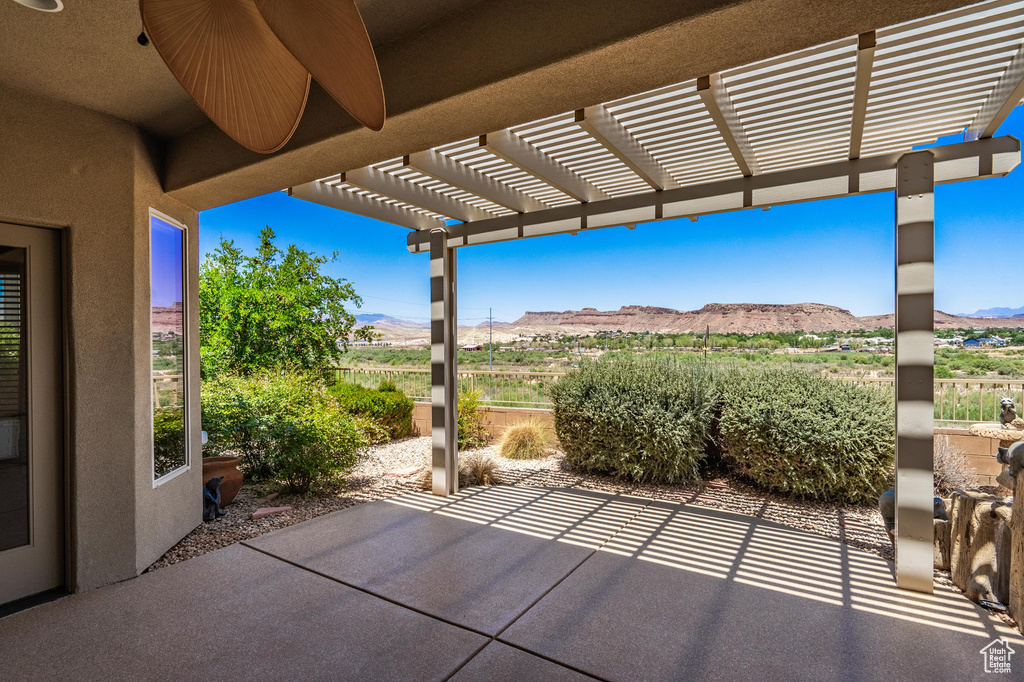 View of patio featuring a mountain view and a pergola
