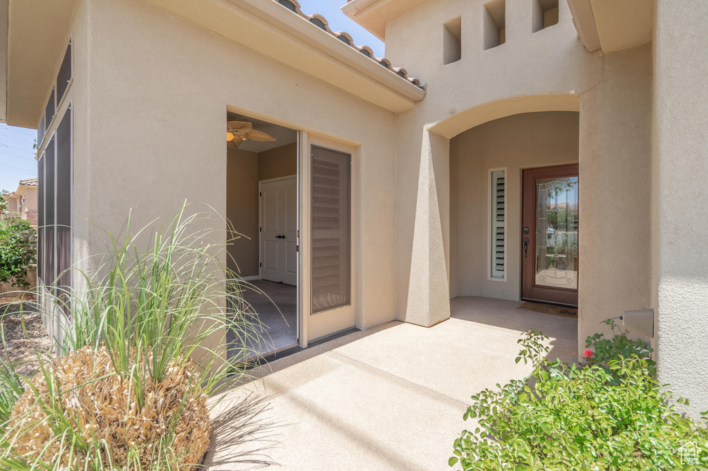 Property entrance featuring stucco siding