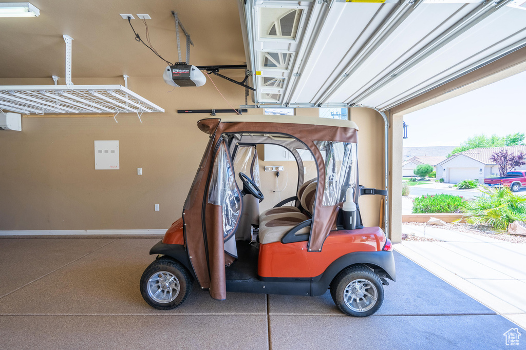 Garage featuring a garage door opener