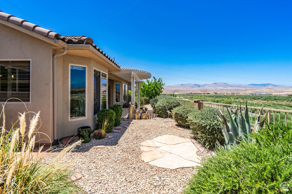 View of yard featuring a mountain view and a pergola