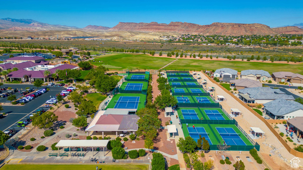 Aerial view of residential area with mountains and a golf course