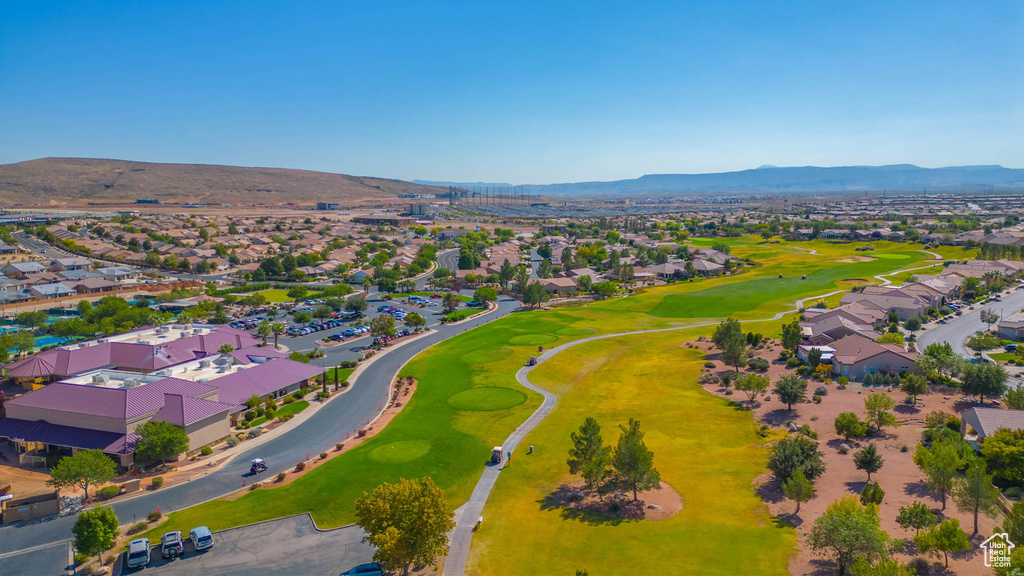Aerial view of residential area with mountains and a golf course