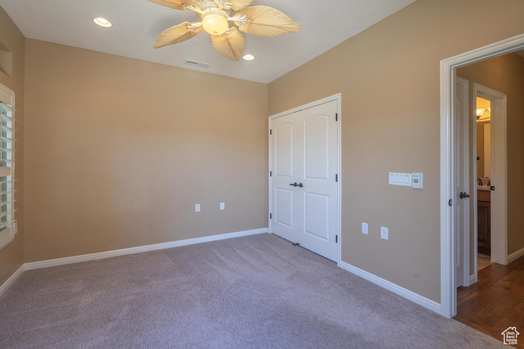 Unfurnished bedroom featuring carpet, recessed lighting, and a ceiling fan