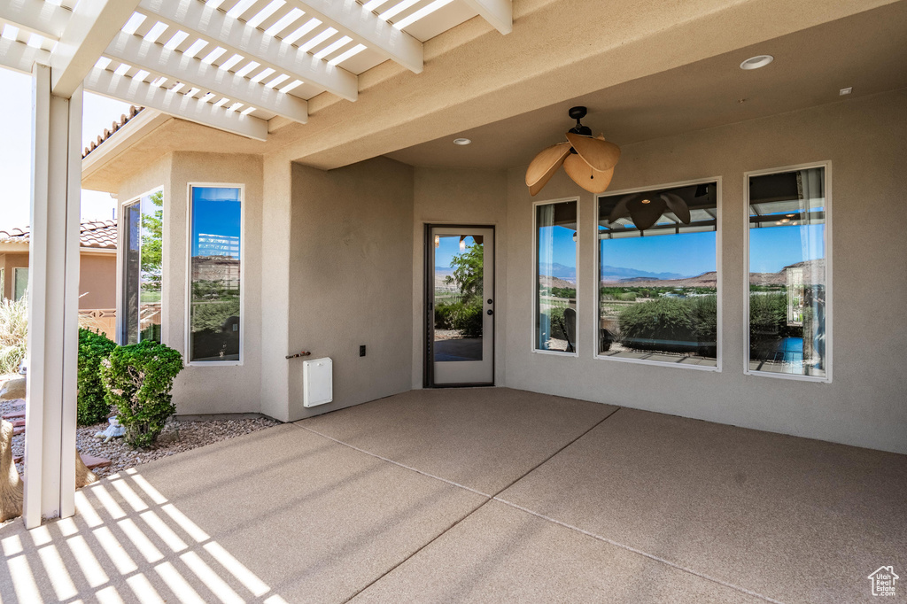 View of patio / terrace featuring ceiling fan and a pergola