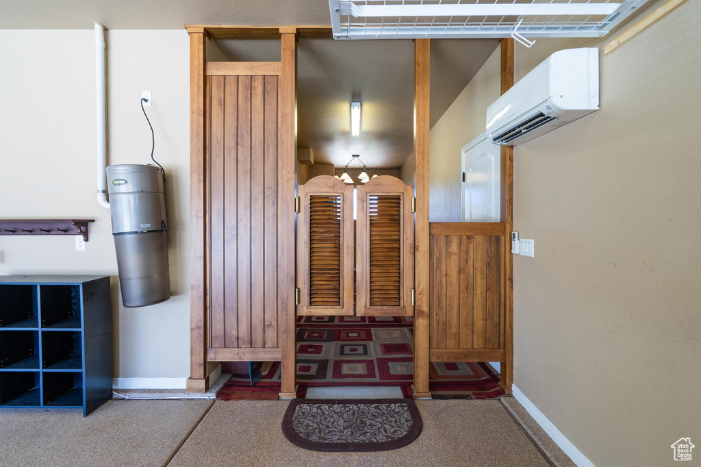 Interior space featuring a wall mounted AC and a gate