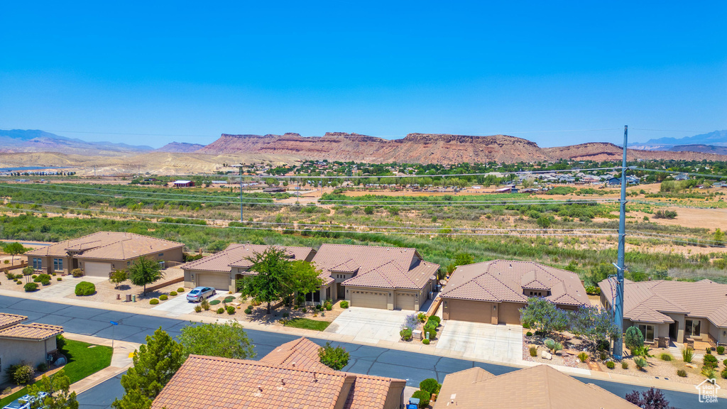 Aerial view of residential area featuring a mountain backdrop
