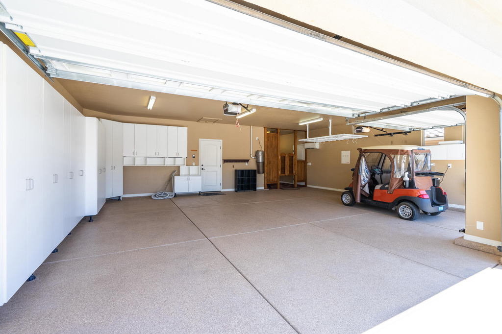 Garage featuring a garage door opener