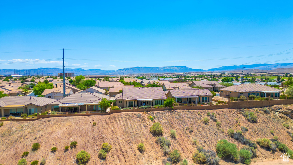 View of mountain background featuring nearby suburban area