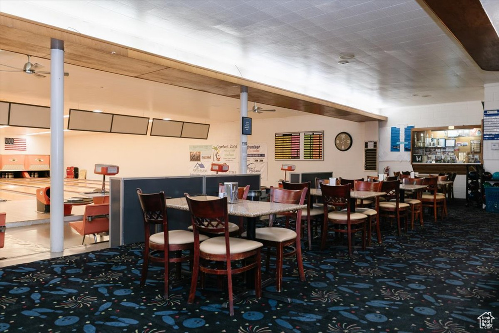 Dining room with carpet and a bar