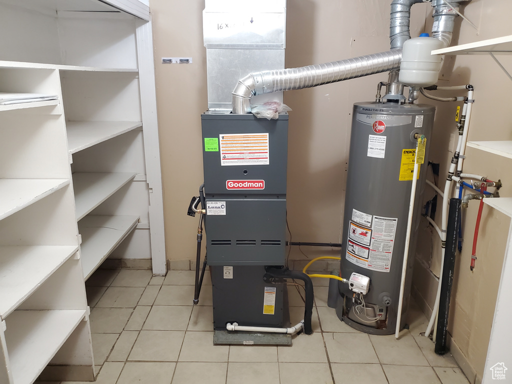Utility room featuring water heater