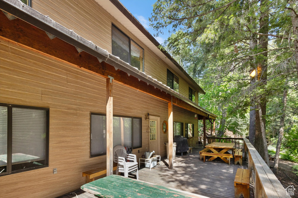 Wooden deck featuring grilling area