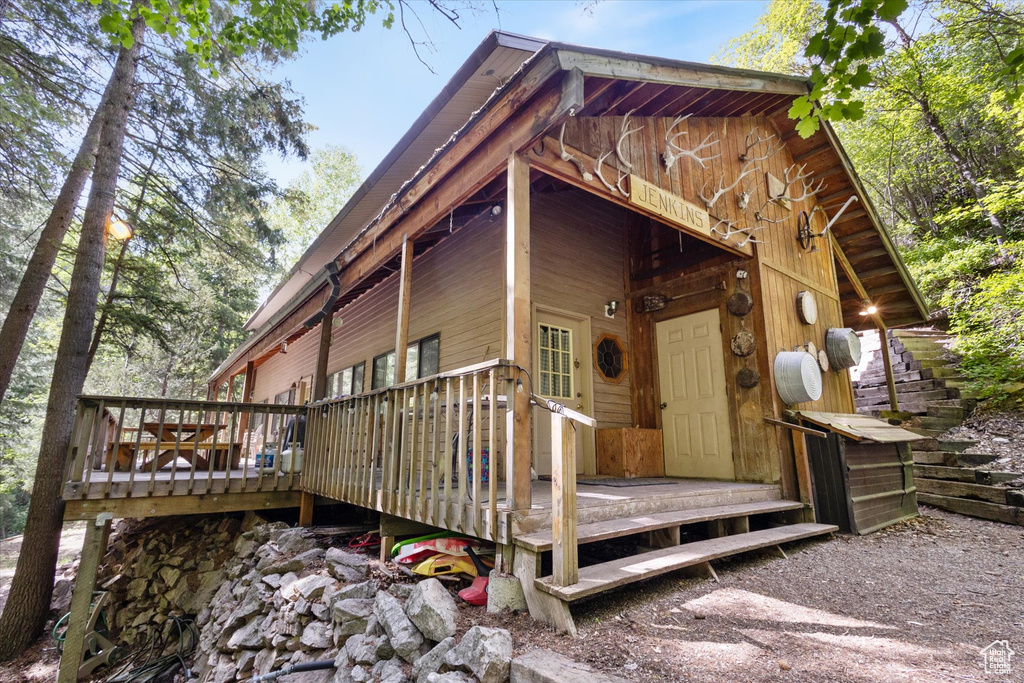 Doorway to property featuring a deck