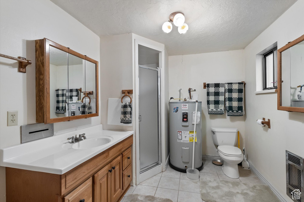 Bathroom with water heater, heating unit, vanity, a shower stall, and a textured ceiling