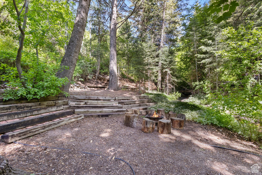 View of yard with an outdoor fire pit