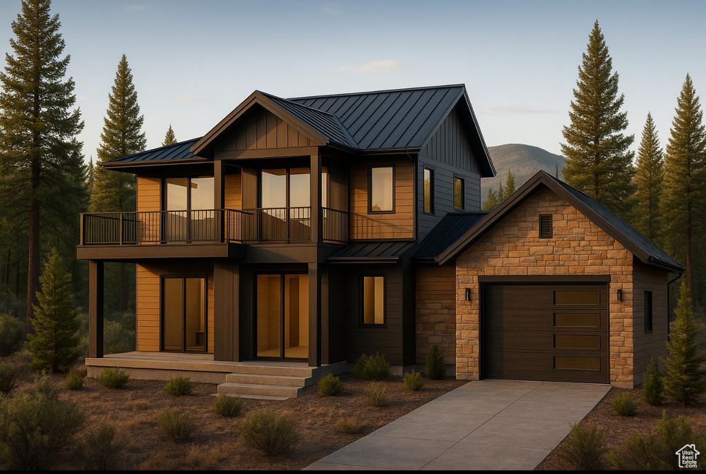 View of front of home with a standing seam roof, a balcony, a metal roof, and a garage
