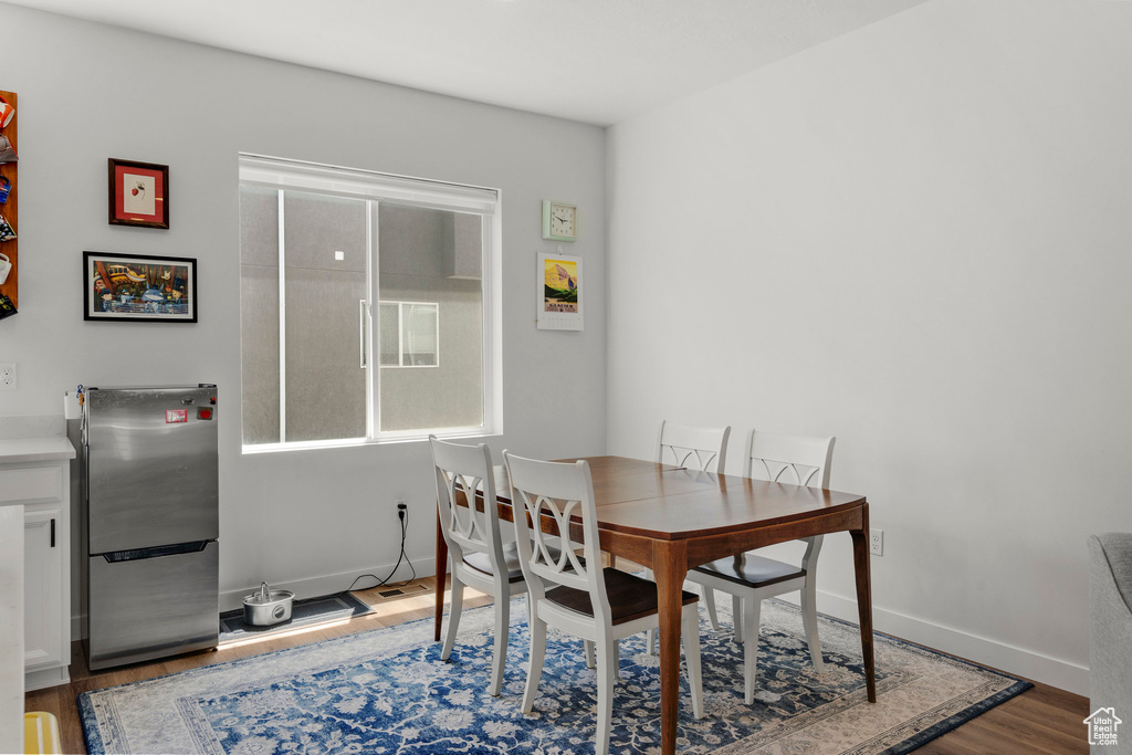 Dining area featuring wood finished floors and baseboards