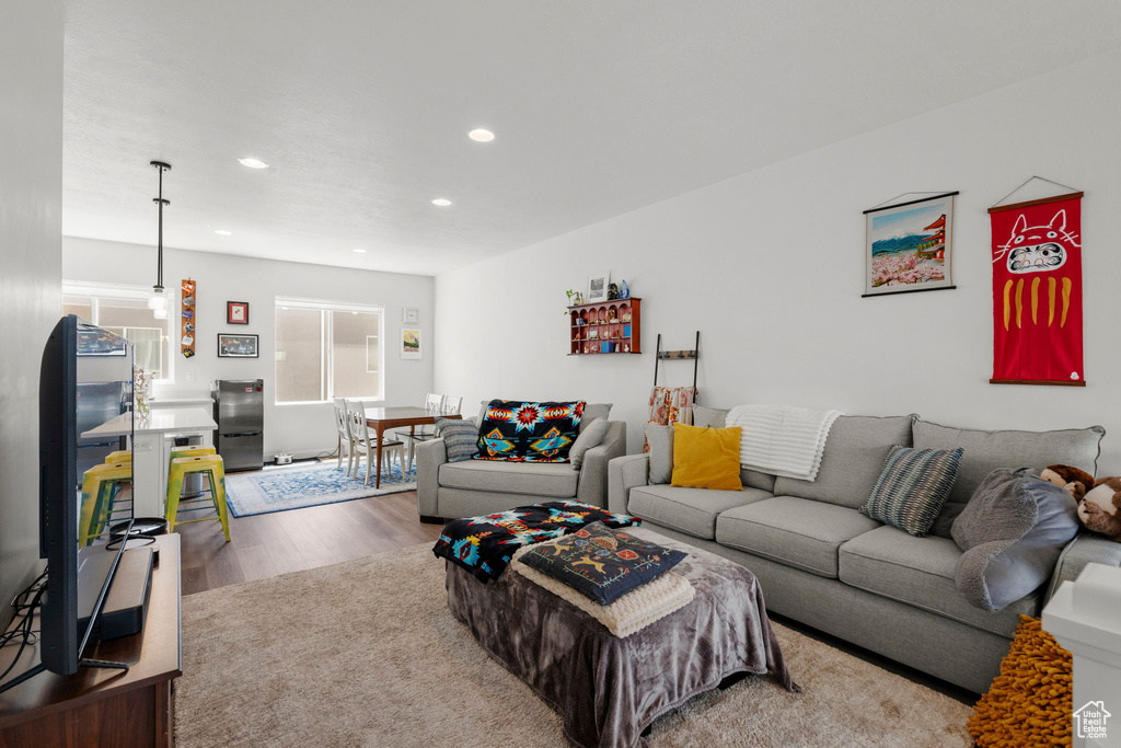 Living room with wood finished floors and recessed lighting