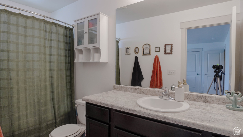 Full bath featuring vanity and a shower with curtain