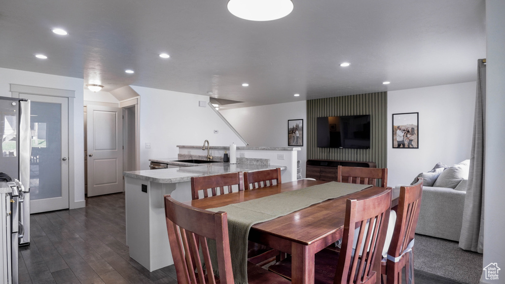 Dining area featuring recessed lighting and dark wood-style flooring