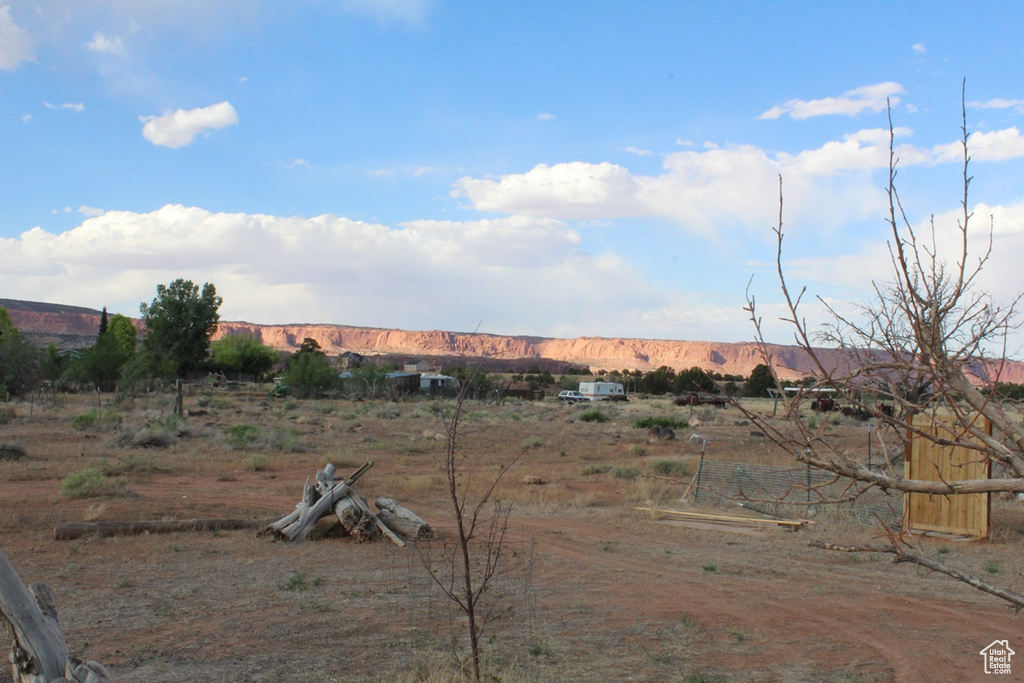 View of yard featuring a view of rural / pastoral area and a mountain view